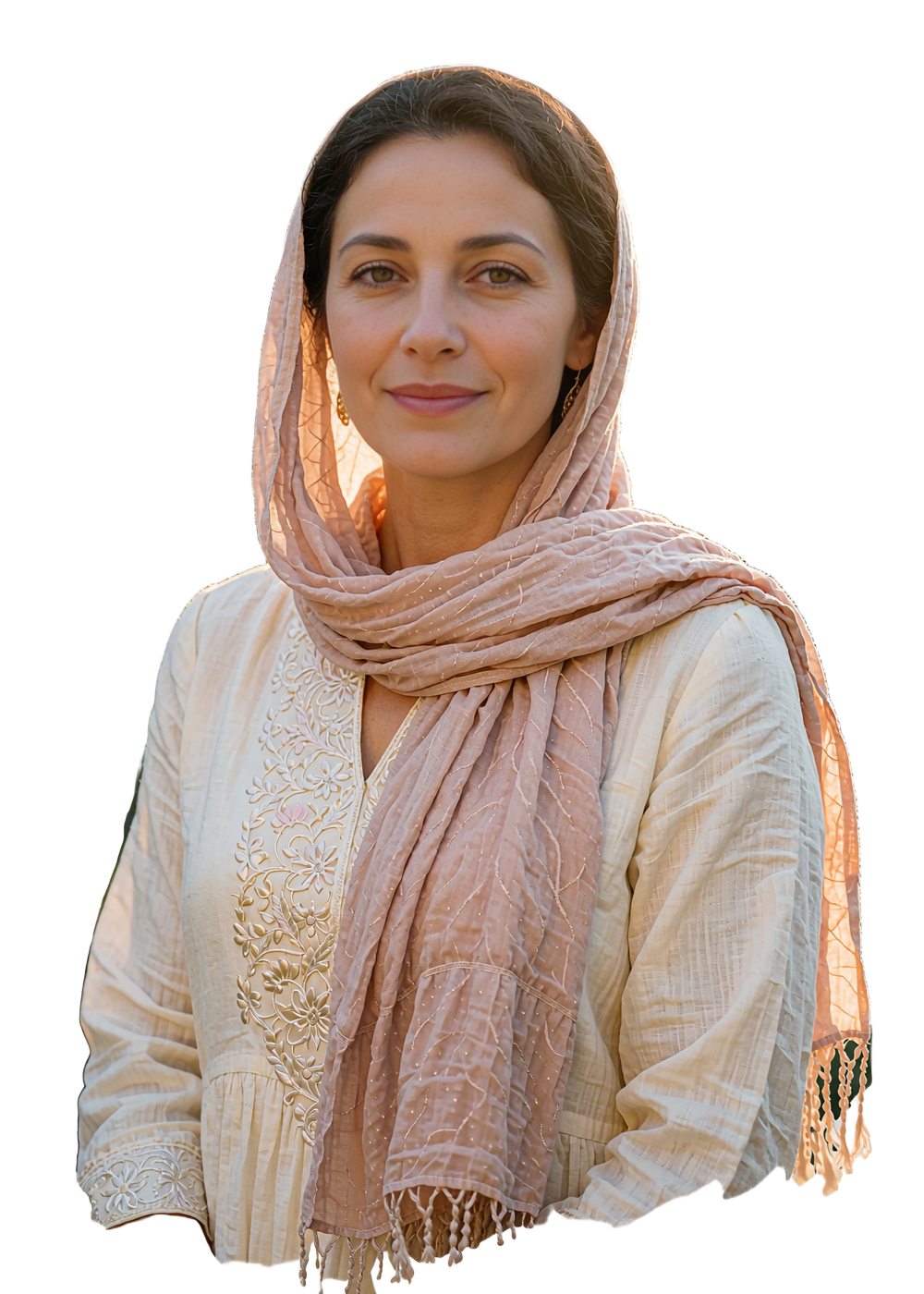 Elegant Yemeni woman in a blush headscarf and embroidered cream dress smiling warmly in a garden setting